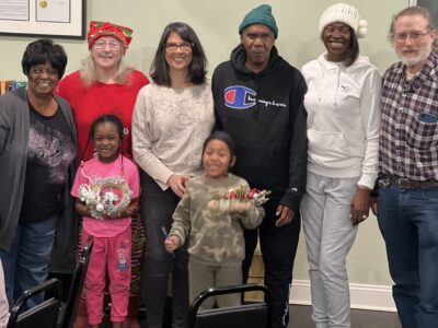 Group photo of the board members and two children