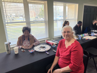 Pat and Sue at a crafting table