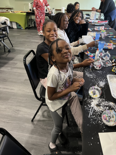 Kids decorating snowglobes