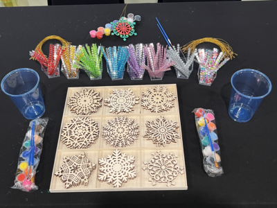 Supplies to paint a wooden snowflake