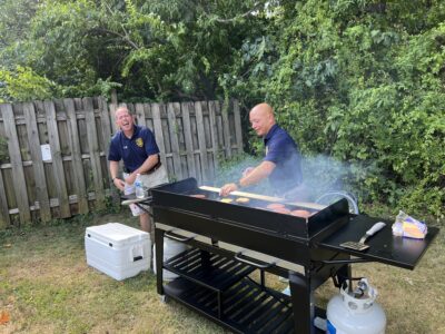 Outgoing police chief grilling food