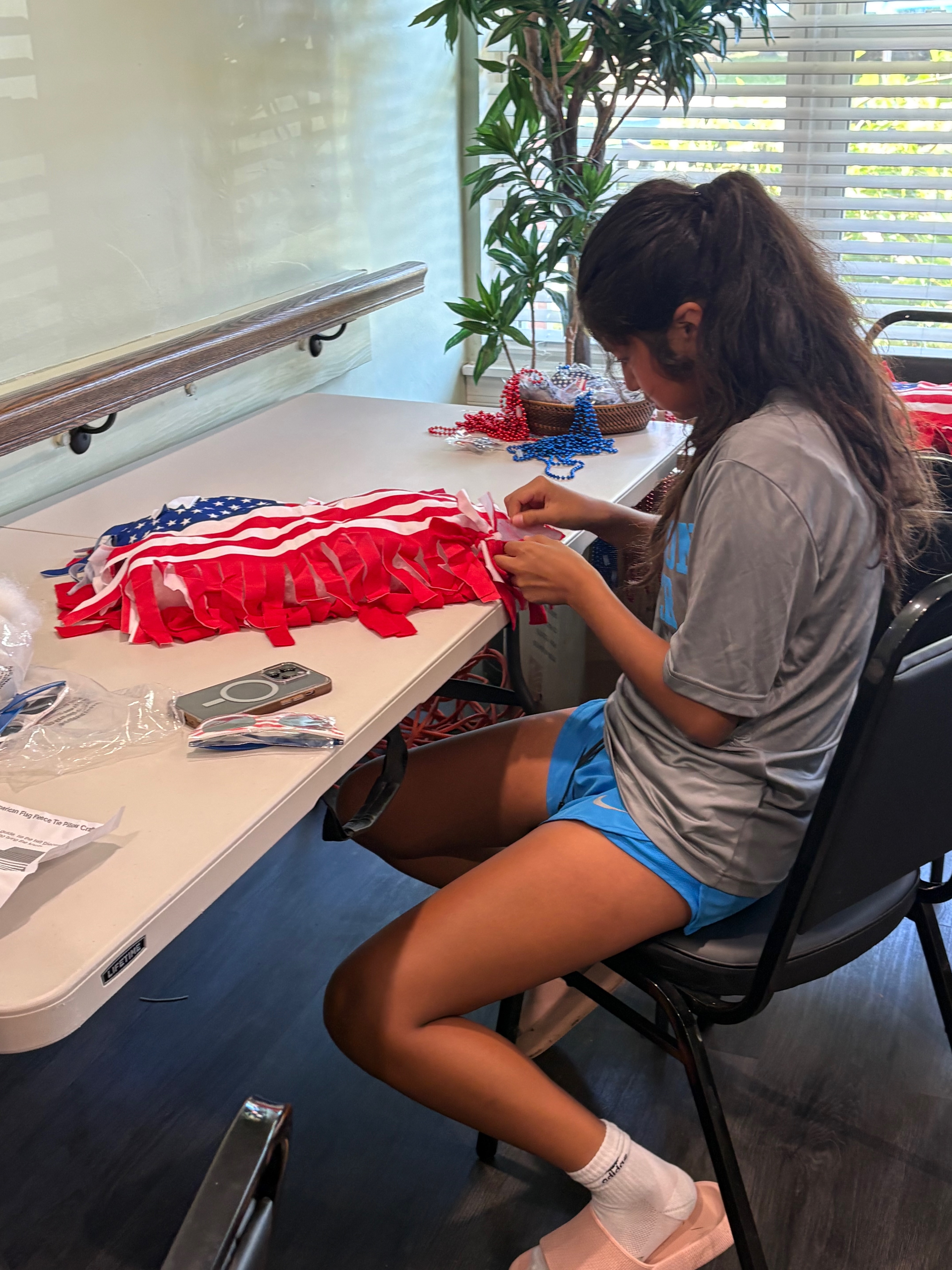 Tenant working on a flag
